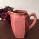 Old pitcher in earthenware of a very pretty pink
