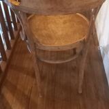 Curved wood armchair