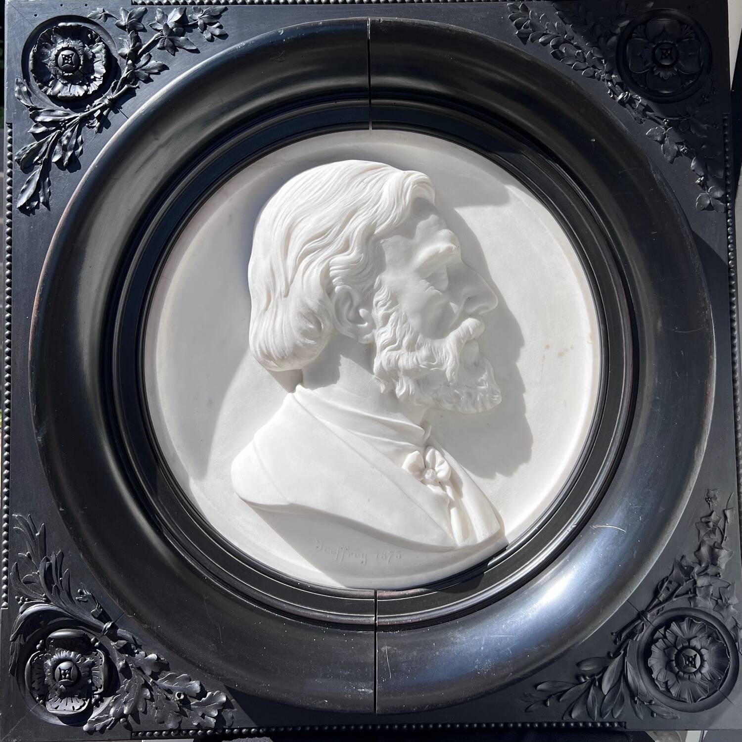 Bas-relief in marble and carved ebony signed Jouffroy, 1873