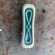 Set of 12 knife holders in green and beige glazed ceramic, slip,