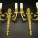 Pair of wall sconces, quiver and eagle heads, Louis XVI style - gilded bronze