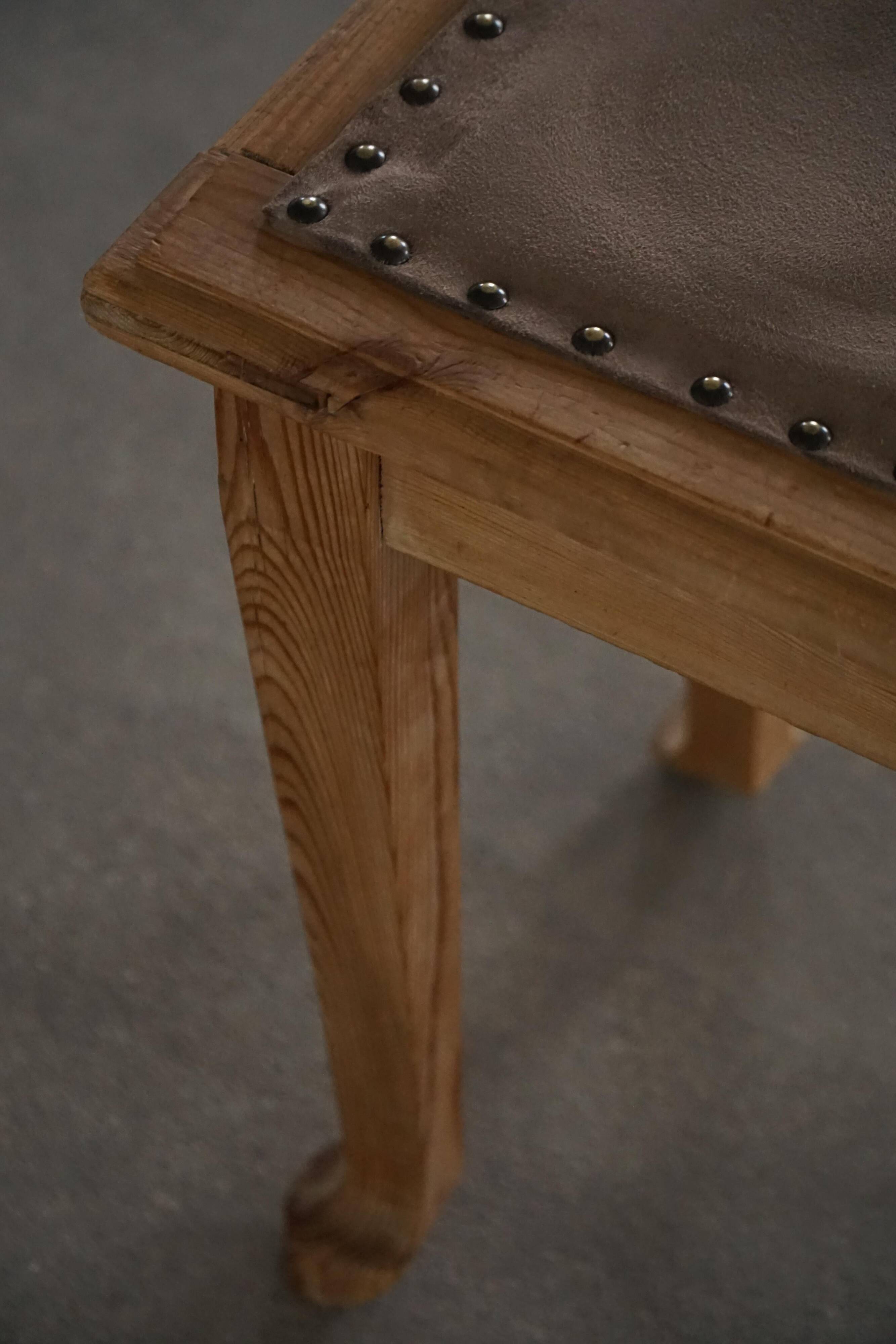 A pair of antique Danish pine stools from the late 19th century.