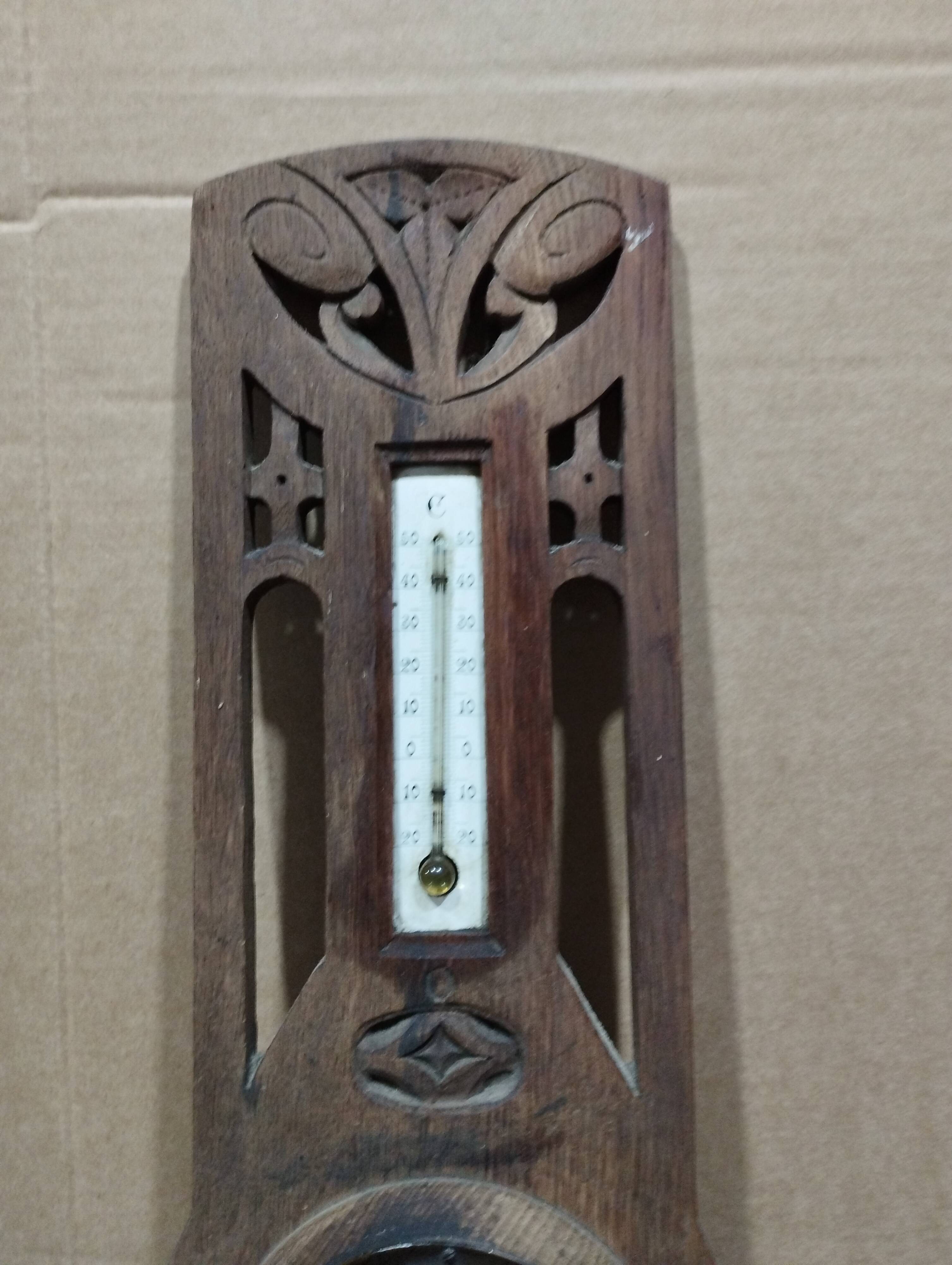 Old barometer and thermometer from the 1930s in carved wood. Signed on the back EH PARIS.