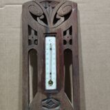 Old barometer and thermometer from the 1930s in carved wood. Signed on the back EH PARIS.