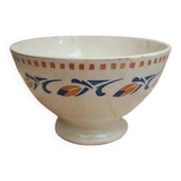 Old ironstone bowl with vintage blue and ochre decoration.