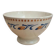 Old ironstone bowl with vintage blue and ochre decoration.
