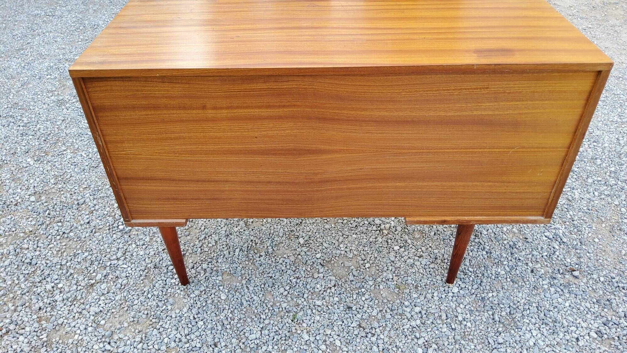60s desk in golden blond mahogany with conical coffered feet