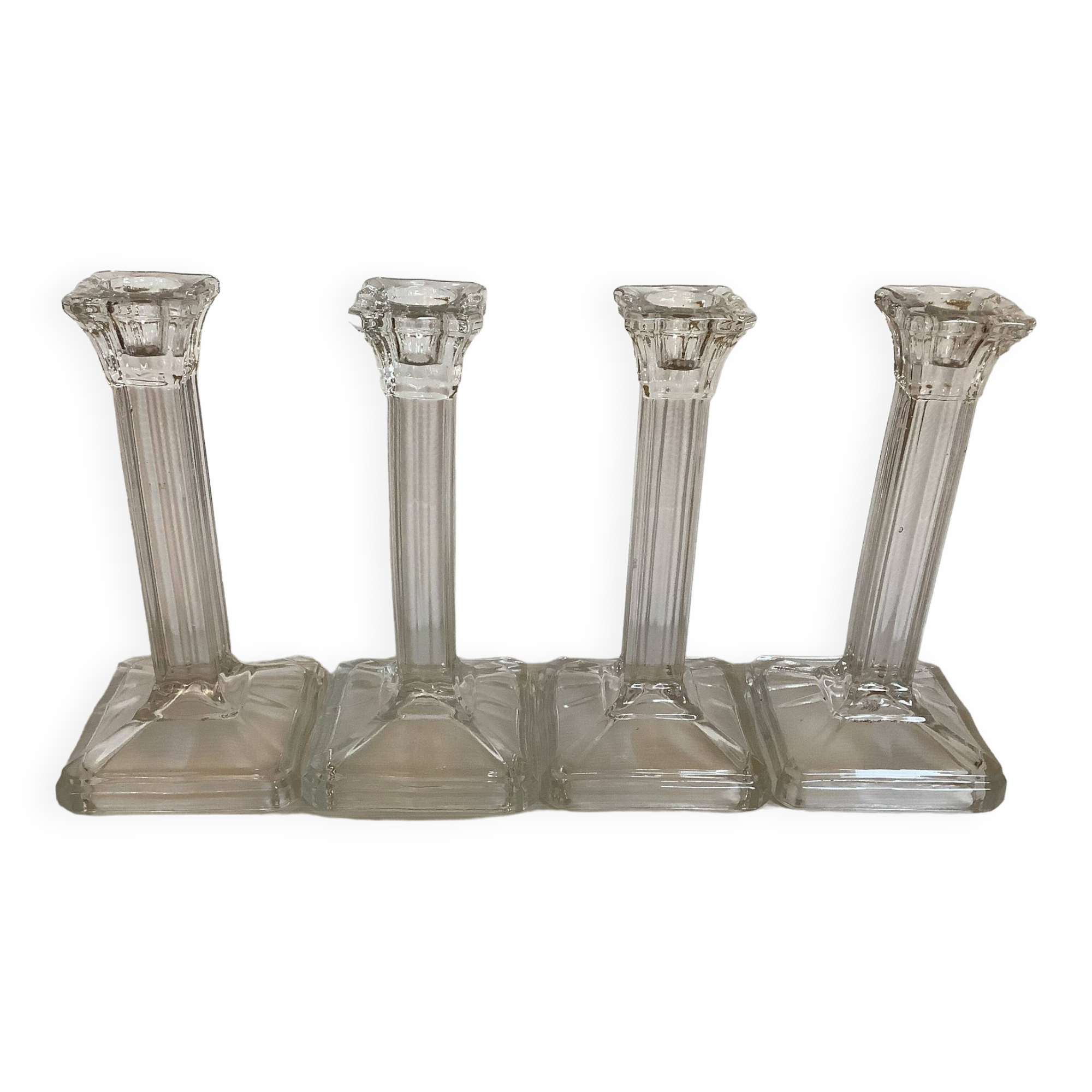 Four old square molded glass candlesticks
