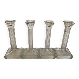 Four old square molded glass candlesticks