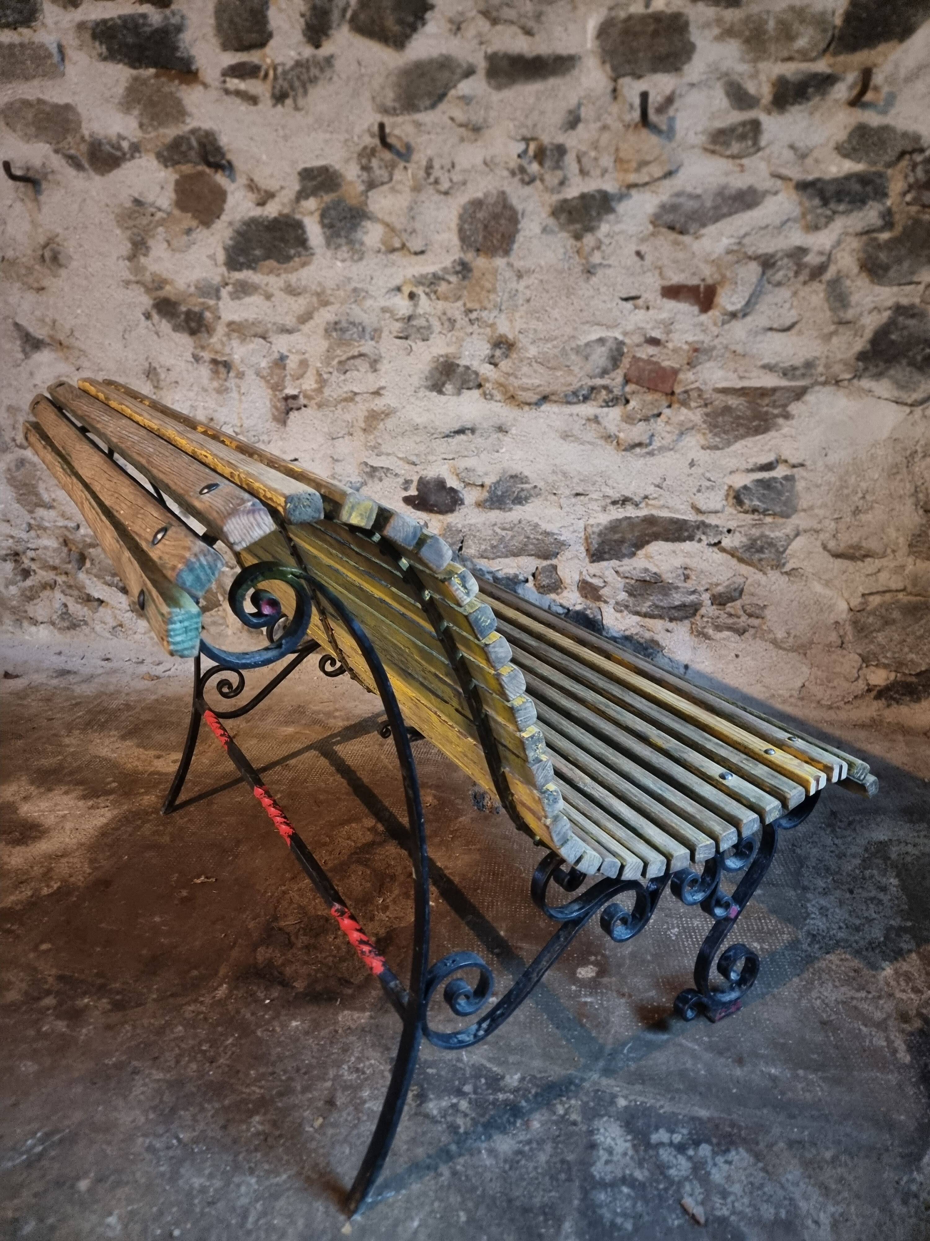 French garden bench in iron and wooden slats, mid-20th century.