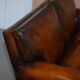 Two-seater canapé in aged leather, Victorian style.