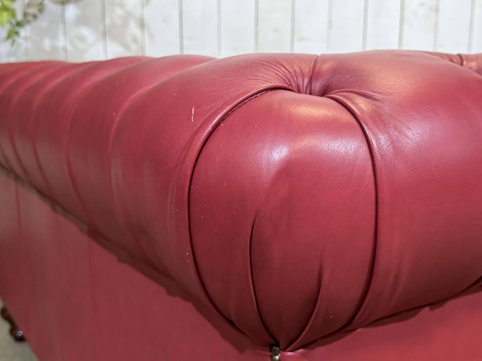 Chesterfield 2-seater leather sofa, modern production from the 2000s.