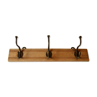 Wall mounted coat rack with 3 brass hooks, vintage from the 1950s
