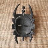 Decorative mask hand carved in tribal ethnic painted wood