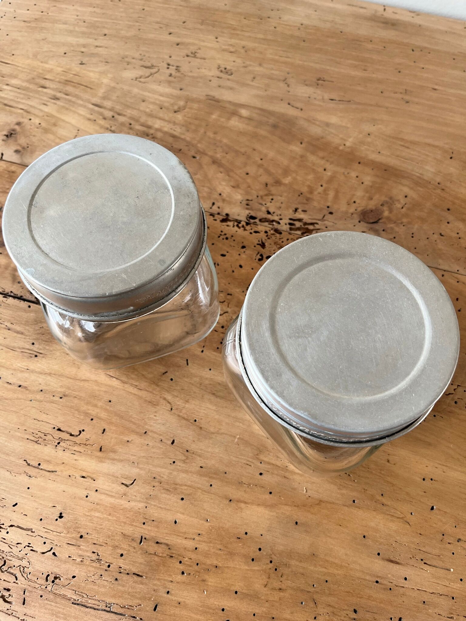 Set of 2 antique jars with aluminum lids