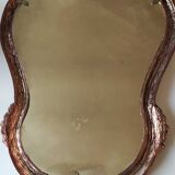 Pretty Baroque style mirror / Louis XV patinated with pink / golden copper reflections. Volutes, leafy shells