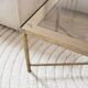 Coffee table in gold metal and glass