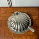Shell-shaped butter dish in stainless steel