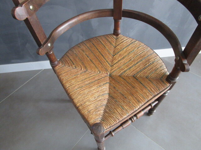 Old straw corner armchair