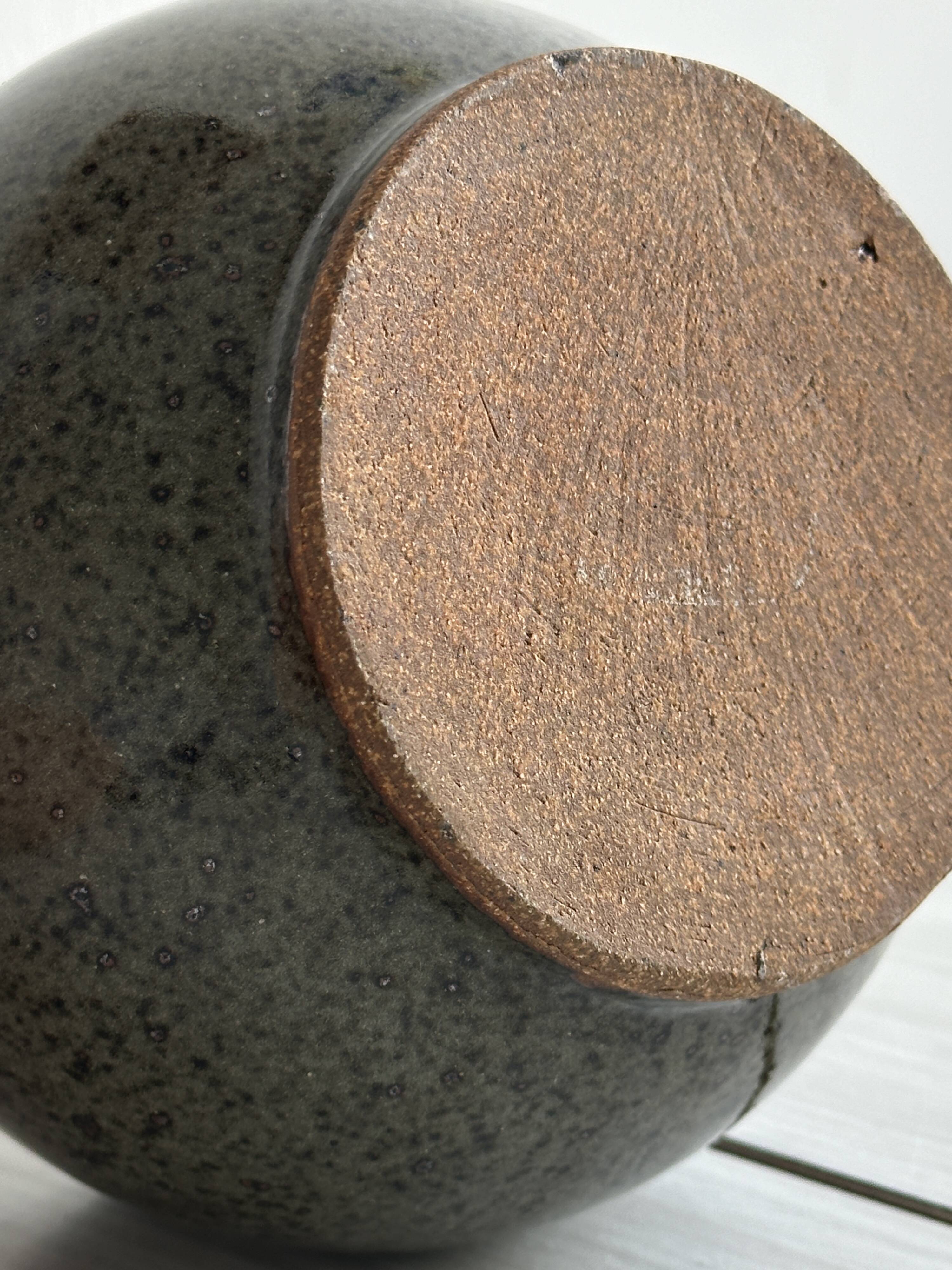 Vase - stoneware pot holder.