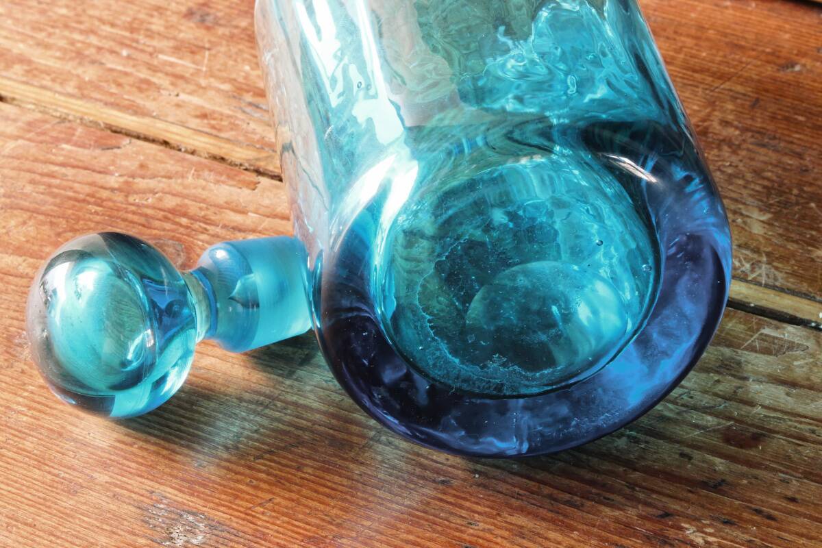 Large blown crystal bottle, twisted, turquoise blue, early 20th century.