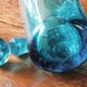 Large blown crystal bottle, twisted, turquoise blue, early 20th century.