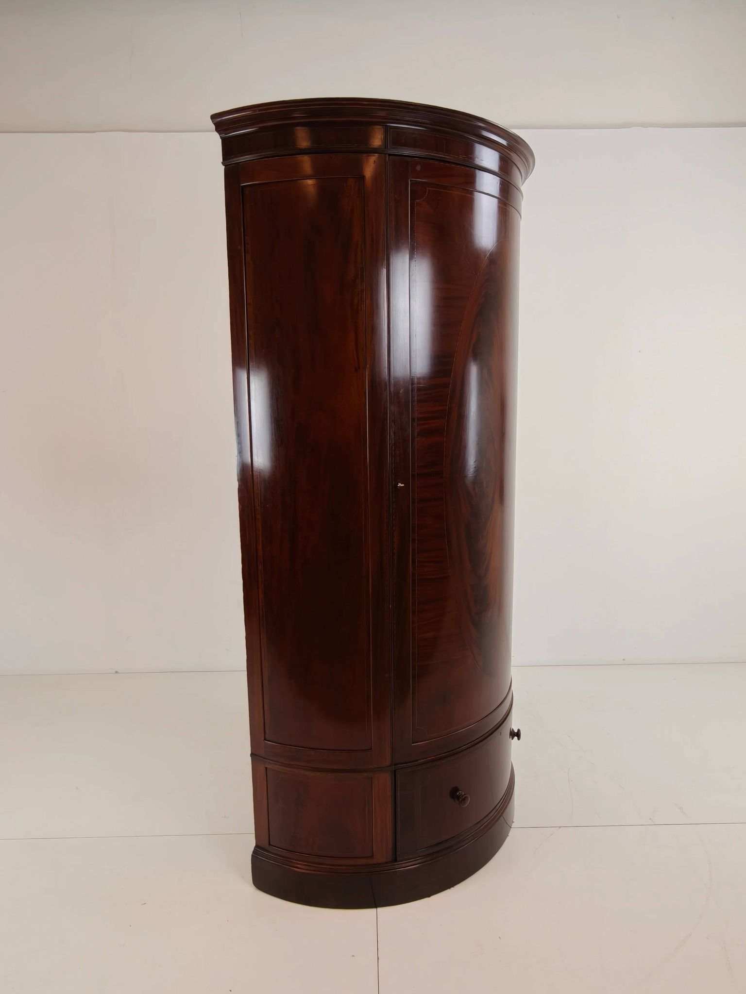Edwardian mahogany bow-fronted wardrobe by Maple & Co