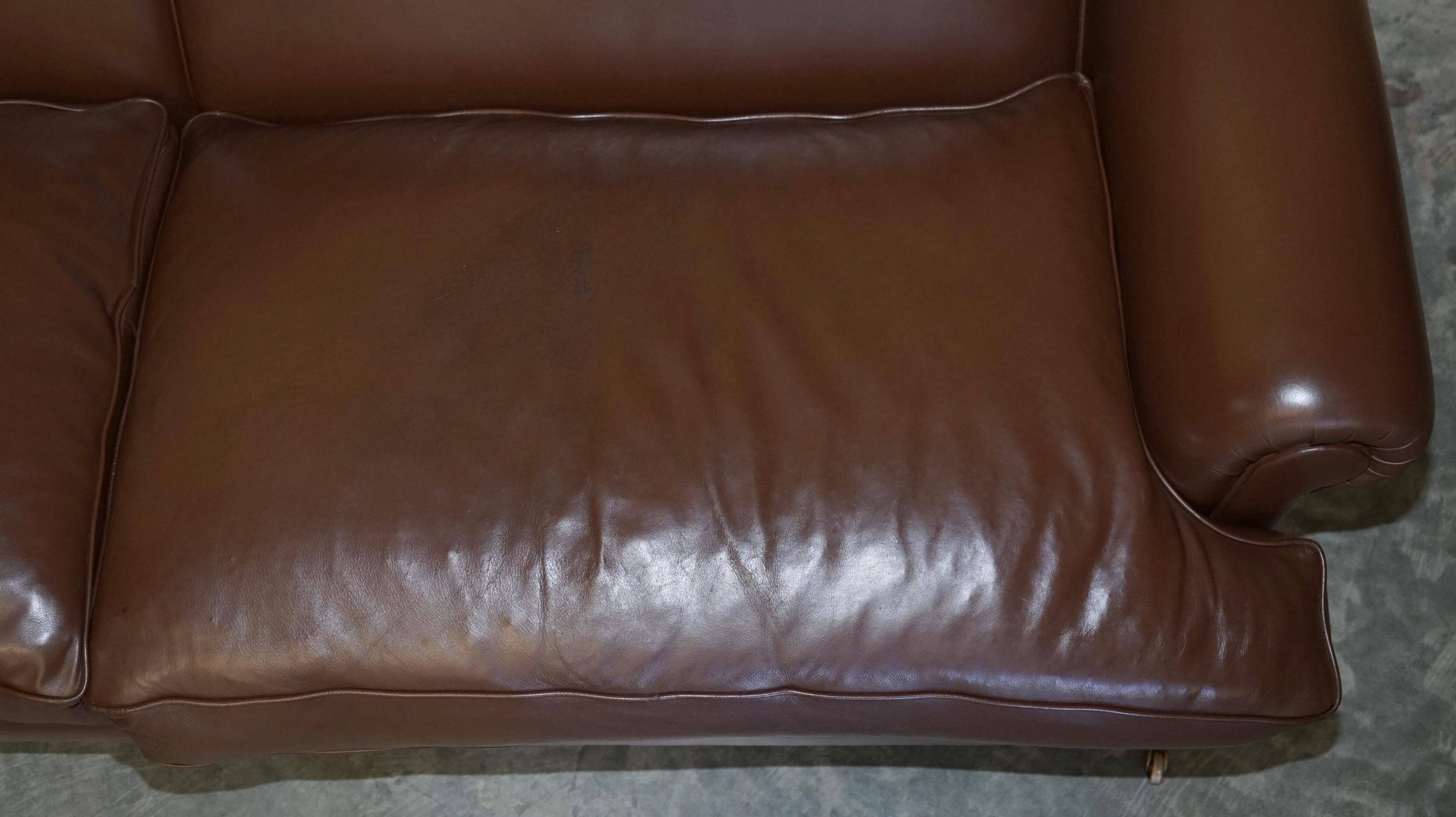 Contemporary Howard & Sons style grand sofa with brass casters.