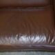 Contemporary Howard & Sons style grand sofa with brass casters.