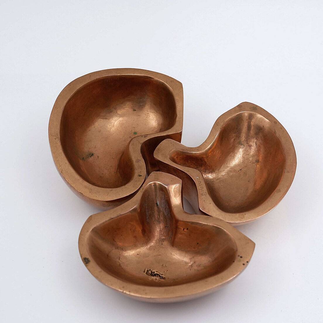 Empty Pockets in polished bronze Margrit van Nuffel 1970, set of 3