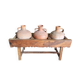 Old wooden jar holder with 3 clay jars