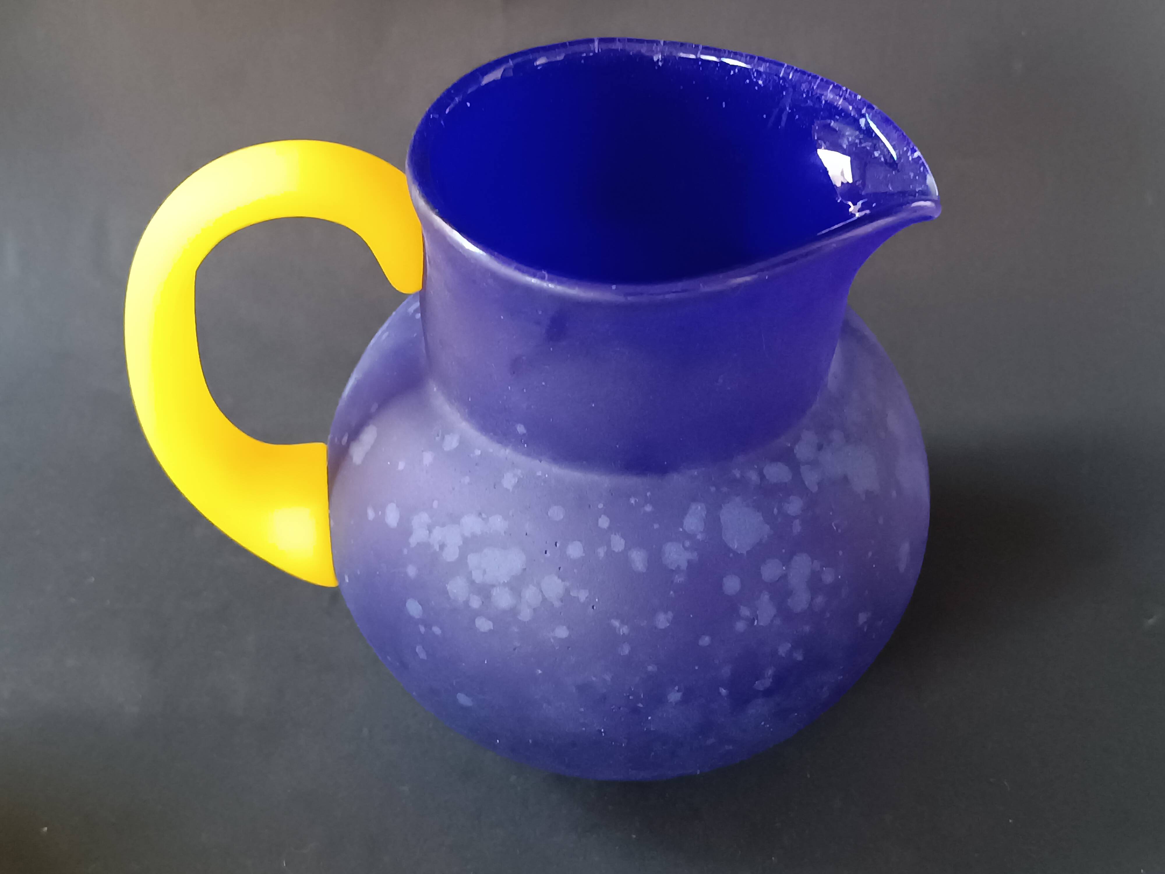 TWO VINTAGE YELLOW AND BLUE GLASS PITCHERS 1990