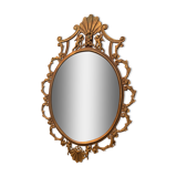 Miroir ovale en laiton doré , figures de chérubins et moulures