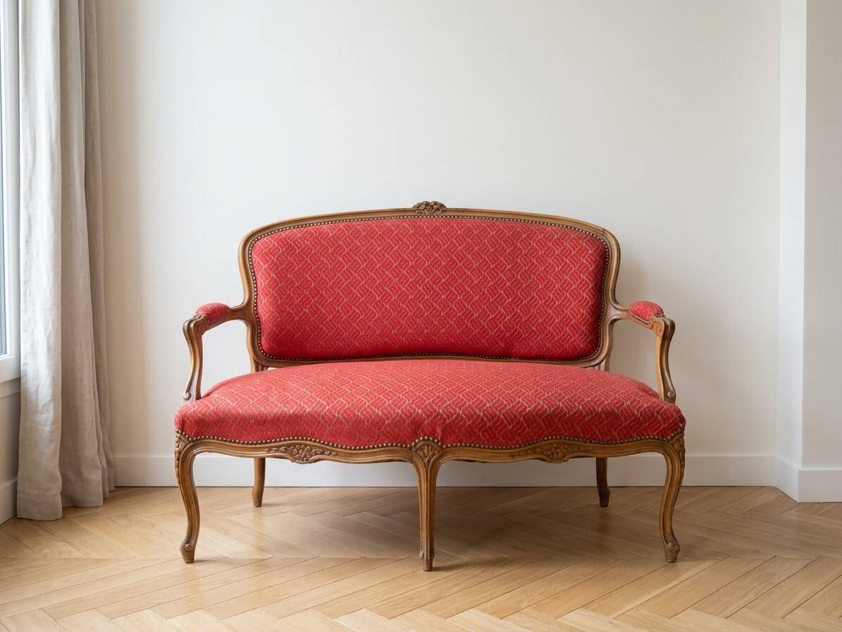 Two-seater Louis XV style sofa in red fabric.