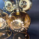 Pair of vintage wall sconces in brass with amber glass globes.
