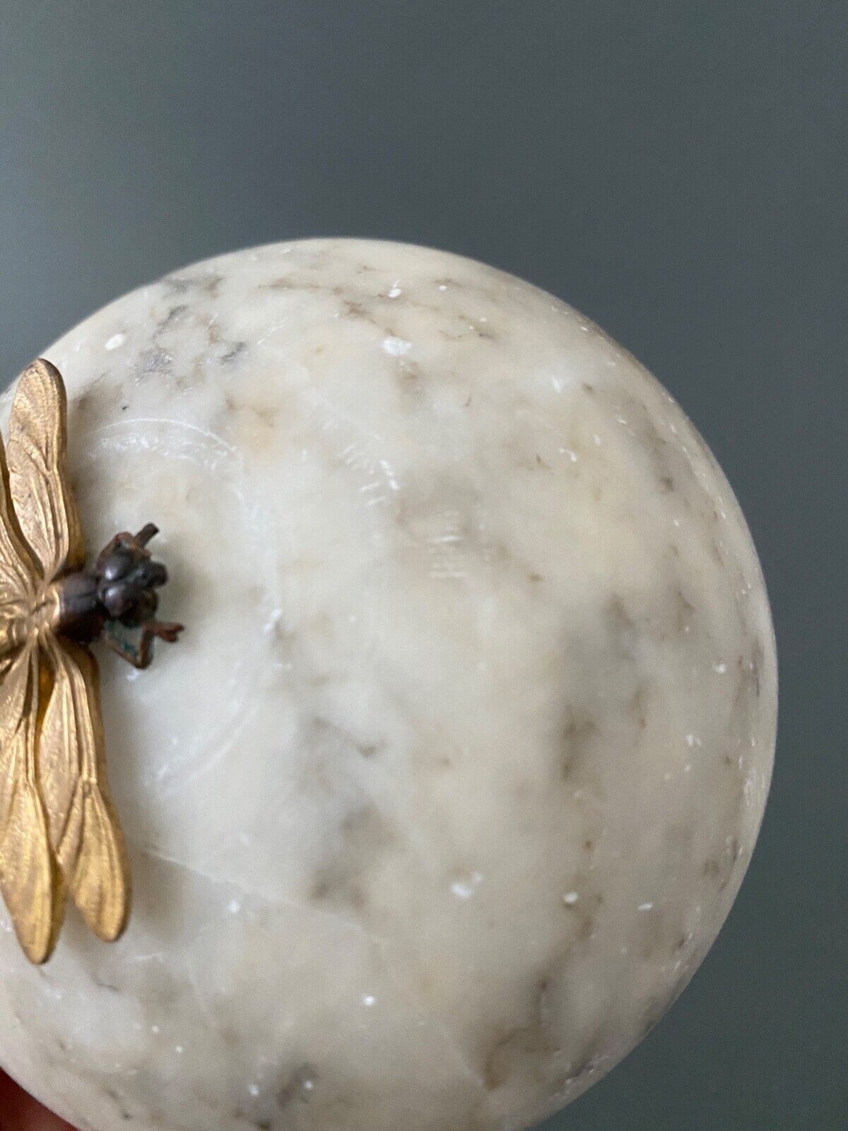 1900 alabaster ball shaped box surmounted by a golden dragonfly