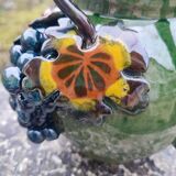 Terracotta pitcher glazed in grape slip signed HB