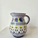 Vintage ceramic pitcher/vase hand-painted with floral decoration.