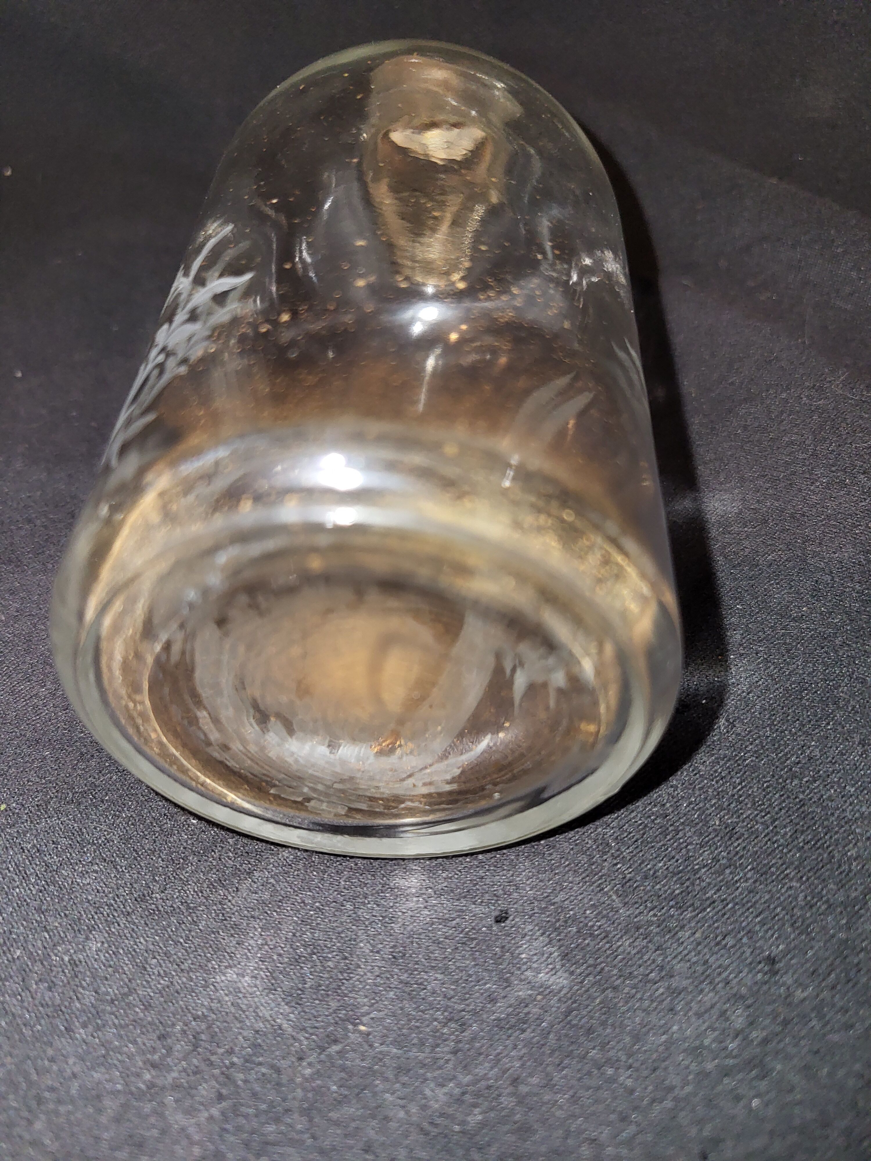 Engraved glass bottle