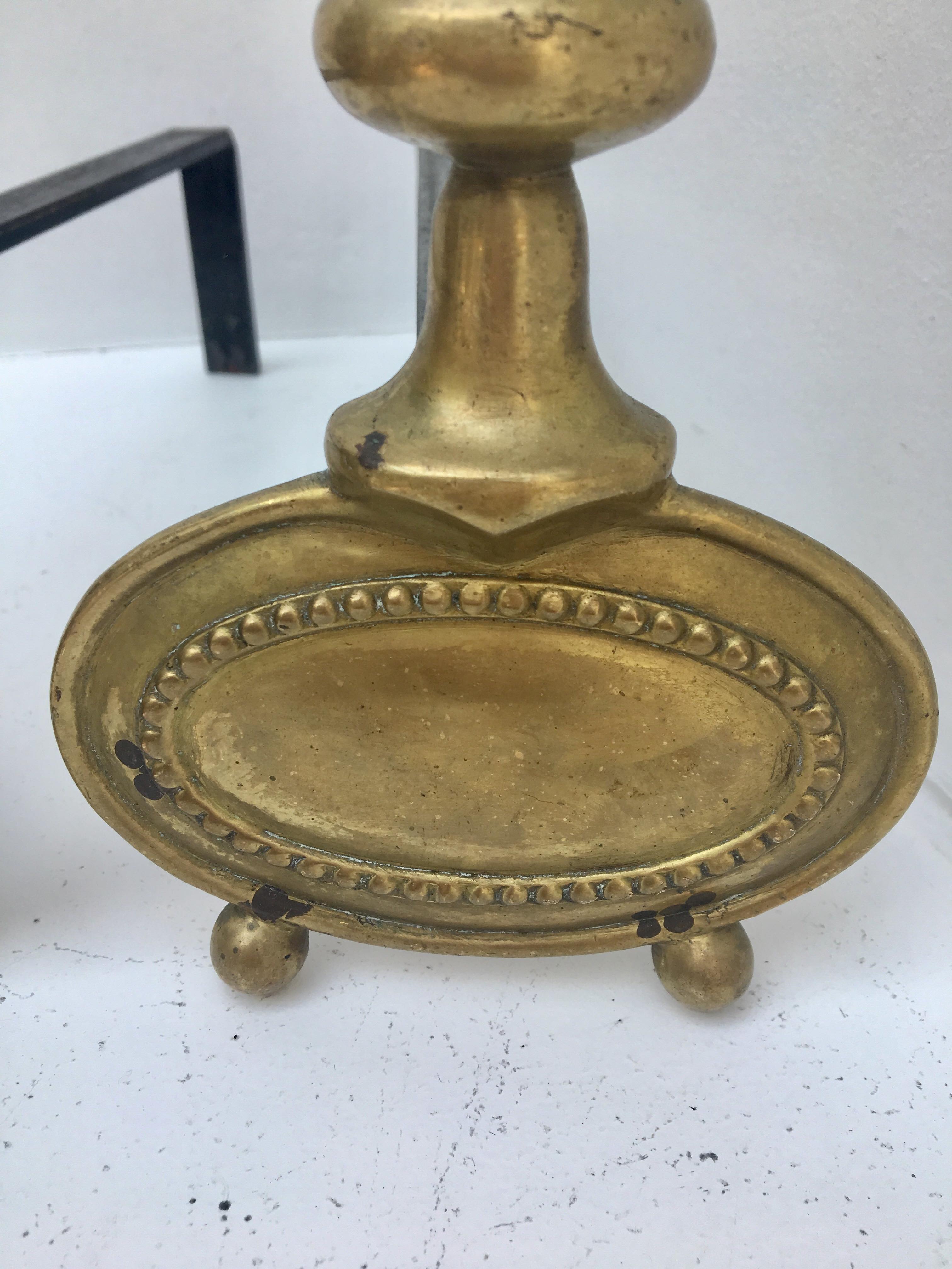 Pair of andirons in brass for fireplace