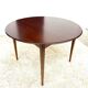 Danish round dining table in rosewood – 1950s design with butterfly extension.