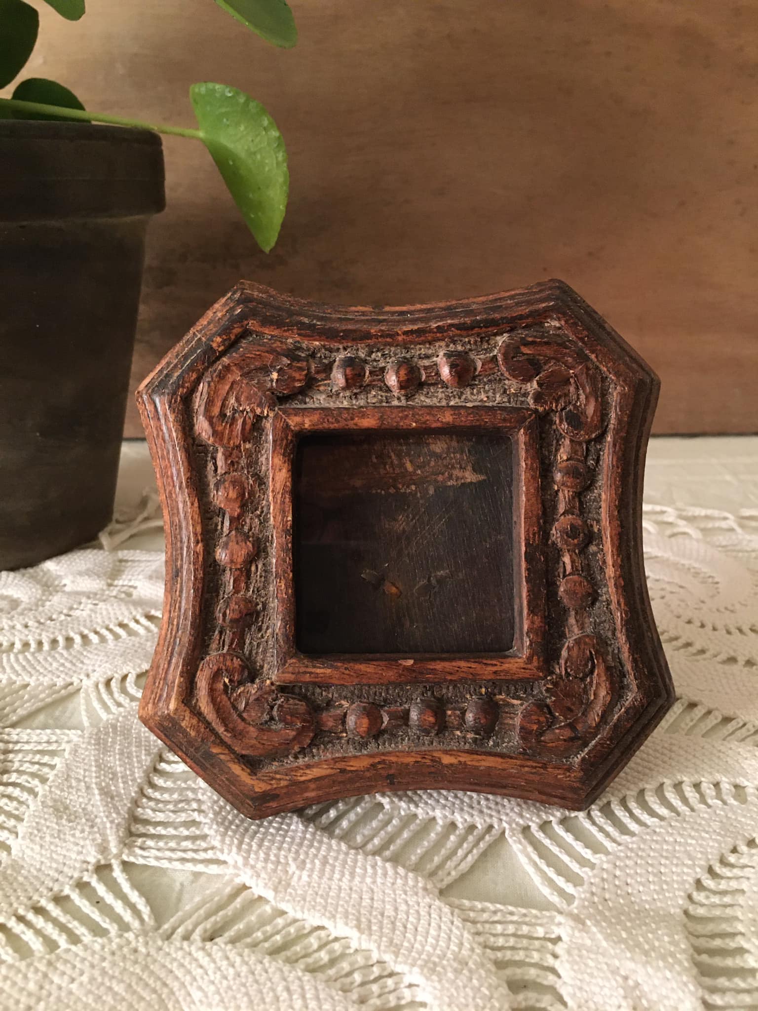 Photo frame in worked wood.