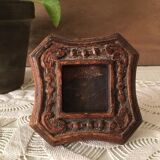 Photo frame in worked wood.