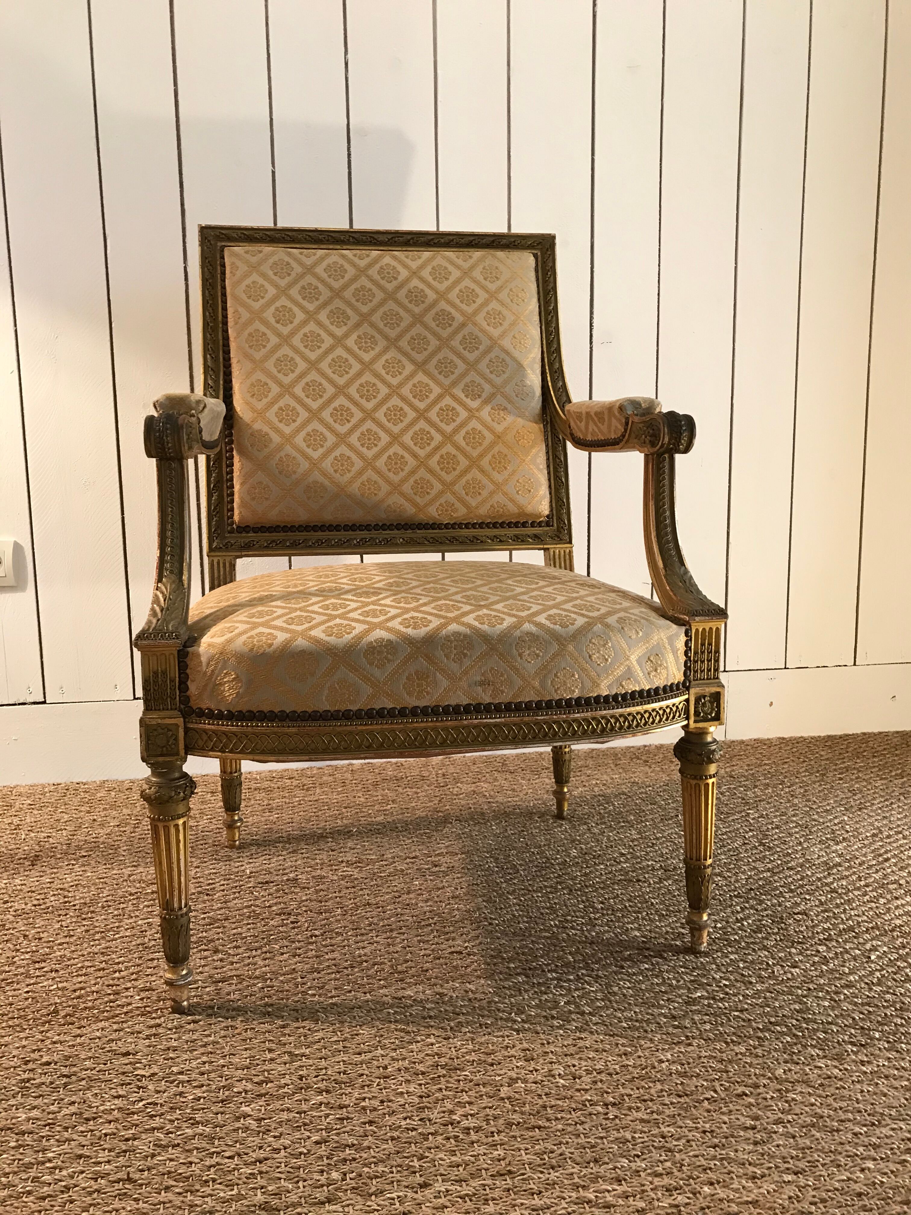 Louis XVI armchair in gilded wood carved and molded