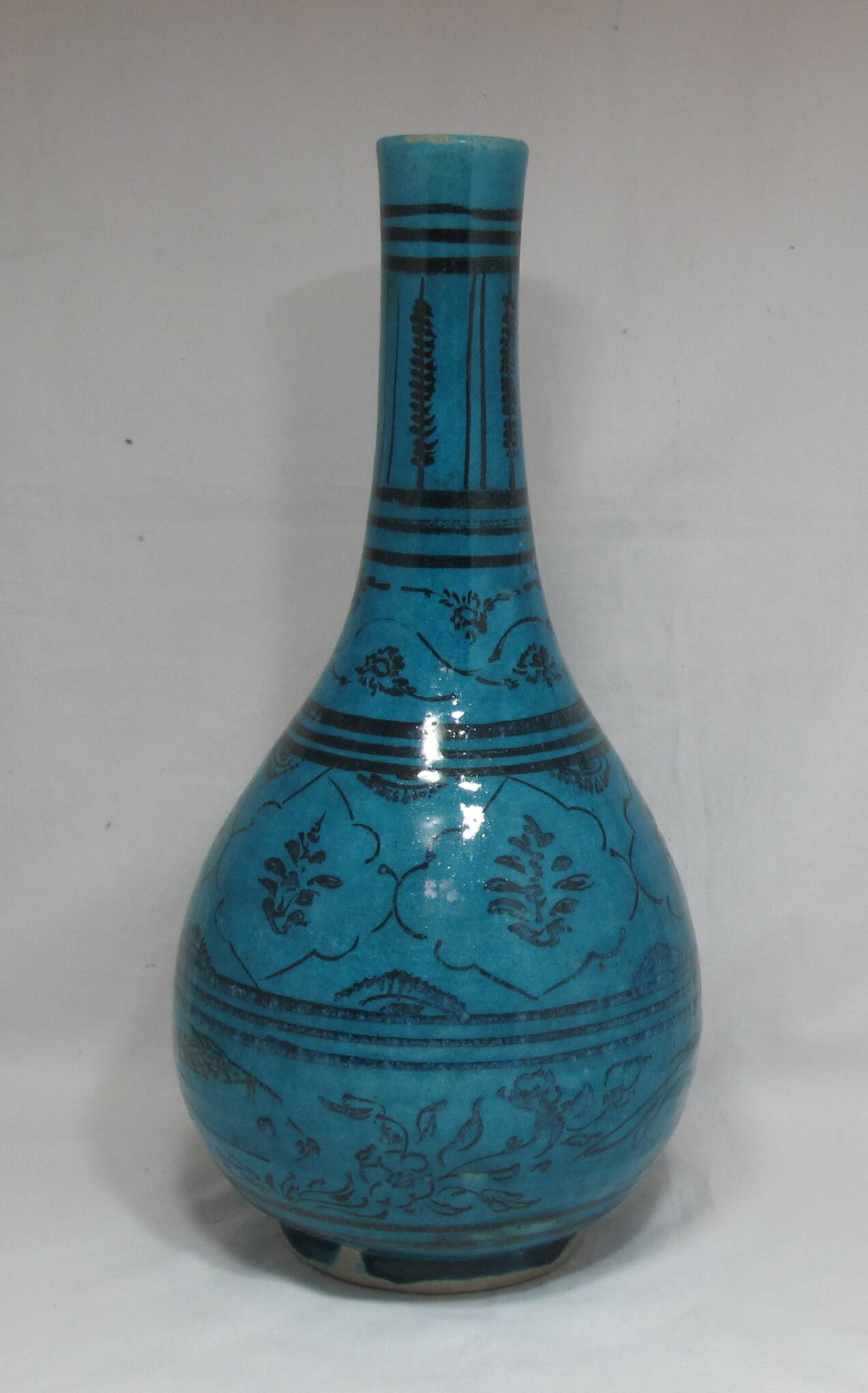 Islamic ceramic vase with turquoise background