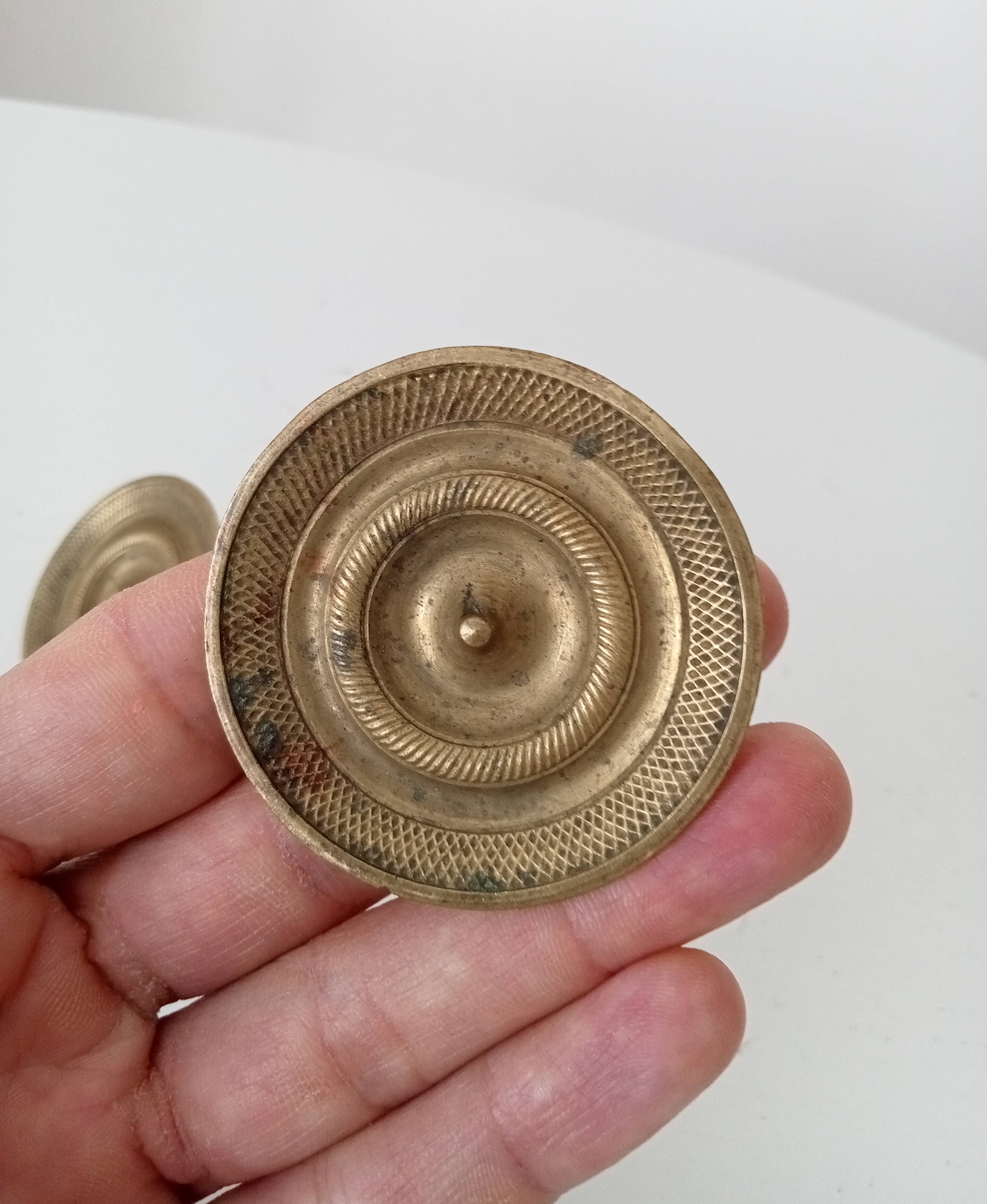 Pair of antique Empire furniture knobs in bronze from the 19th century.