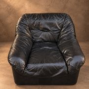 Leather armchairs and matching pouf, Italy, circa 1980