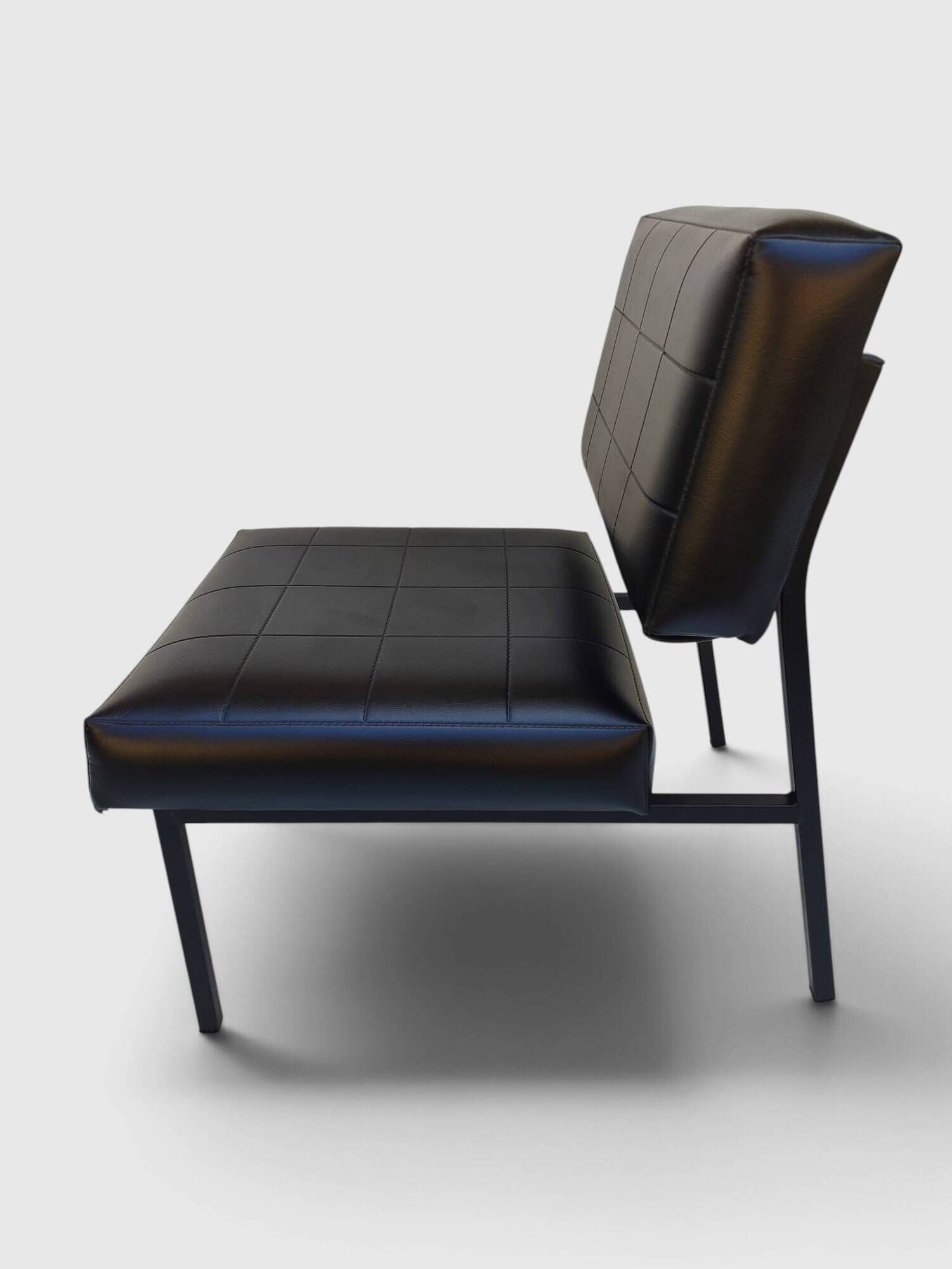 Modernist armchair in black faux leather and metal – 1960s