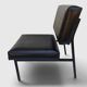 Modernist armchair in black faux leather and metal – 1960s