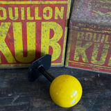 Vintage yellow wooden wall-mounted ball coat hook.